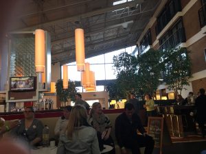 Clear photograph of bar interior looking out towards the hotel entrance