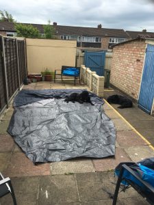 Image shows ground sheet laid out on garden patio