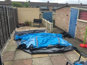 Image of the outer tent laid out flat on the patio ready to assemble