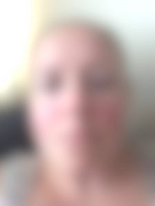 A photograph of my face blurred to look the way I see it.