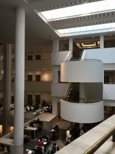 Photograph shows rounded stairwells and the skylights again from inside The British Library